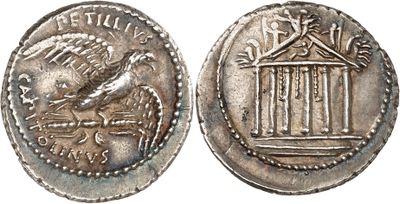 a silver coin with a bird on top of it