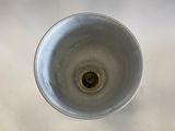 an overhead view of a sink with a drain in it