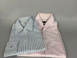 two men ' s dress shirts on a gray surface