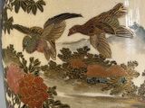 a vase with a painting of birds and flowers on it