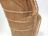 an image of a wicker chair on a white background