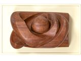 wooden sculpture of a woman holding a child in her arms