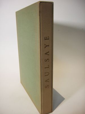 the book is sitting on a white surface with a shadow on it