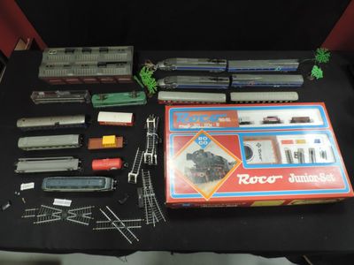 a table with a bunch of toy trains on it