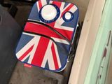 a suitcase with a british flag on it sitting on the floor
