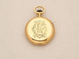 a close up of a gold locke with a picture on it
