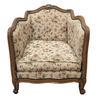 an image of a chair with a floral upholstered back