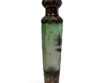 a green vase with a black base on a white background