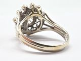 an image of a silver ring with a flower design on it