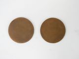two brown circles are shown on a white surface