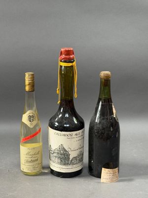 three bottles of wine sitting next to each other on a table