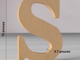 a large wooden letter s with a price tag on it