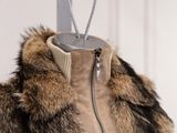 a fur coat on a mannequin with a zipper on it