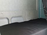 a seat in the back of a van that is empty
