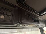 a view of the dashboard of a vehicle with the sunroof