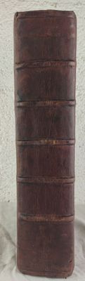 a brown leather case sitting on top of a white table