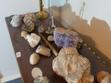 a table with rocks and a lamp on top of it