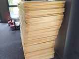 a stack of wood sitting in the corner of a room