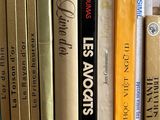 many books that are on a shelf in the room