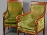 pair of green velvet armchairs with wood frame and arms