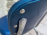 a blue chair with a metal frame and a blue seat
