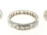 three silver rings on a white surface with a white background
