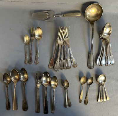 a lot of silver spoons and spoons on the table