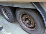 a close up of a flat tire on a truck