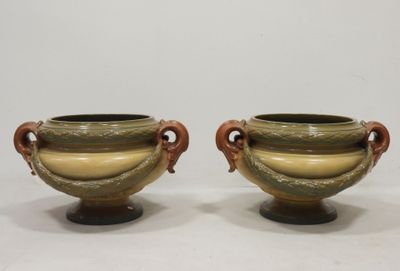 pair of green and brown vases with handles and handles