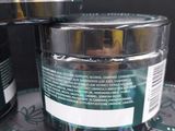 a jar of green power gel next to a can of green power gel