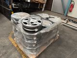 a lot of wheels sitting on a pallet in a warehouse