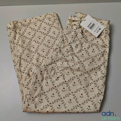 the back of a pair of women ' s pants with a floral pattern