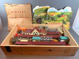 une boîte en bois contenant un circuit de train miniature