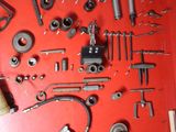 a red wall with a bunch of tools on it