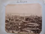 an old photo of a view of a city from the top of a hill