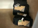 three bags of luggage sitting on a shelf in a closet