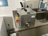 an image of a kitchen with a sink and a faucet