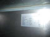 a picture of a sign on the side of a refrigerator
