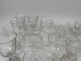 a lot of glasses that are sitting on a table