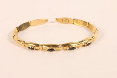 Bracelet rigide ovale en or jaune 750 ‰, serti de quatre cab… - Photo 1