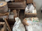 a pile of boxes and boxes of paper on the floor