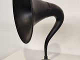 a black horn on top of a white table