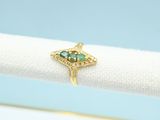 a close up of a ring on a napkin with a blue background