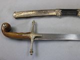 two knives that are sitting on a table