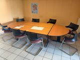 many chairs around a table in a conference room