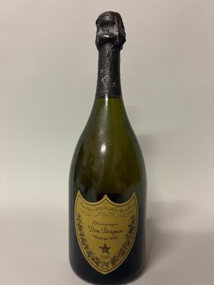 a bottle of champagne sitting on top of a white table