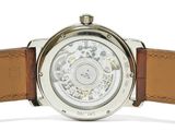 a close up of a watch with a brown strap