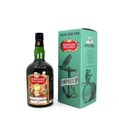 a bottle of rum on the table next to a box