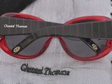 a close up of a pair of sunglasses on a lace tablecloth