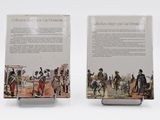 two books on a white surface with a picture of a man in uniform and a woman in a dress